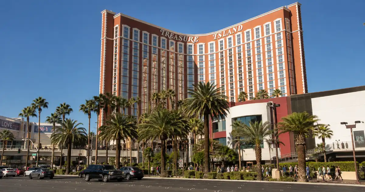 Treasure Island Hotel & Casino rises above its palm-lined frontage along the Las Vegas Strip.
