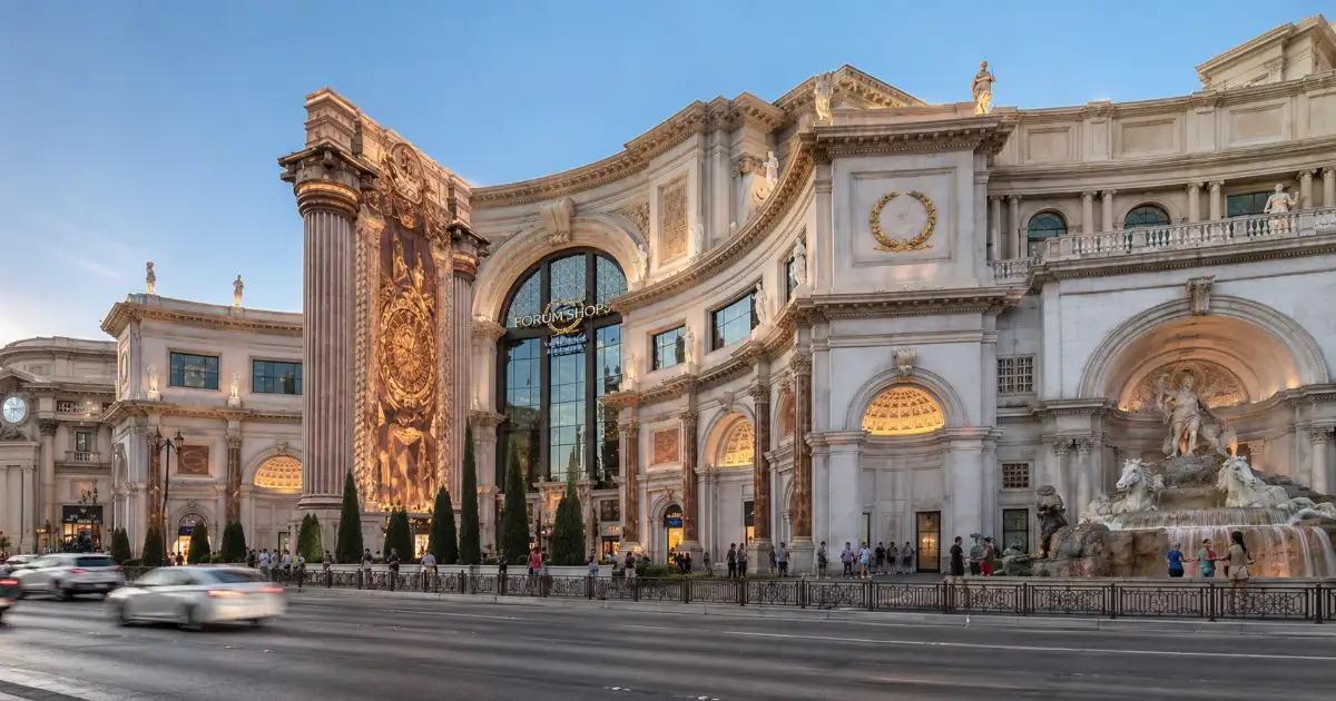 The Roman-inspired entrance, classical statues, and fountain at The Forum Shops at Caesars Palace on the Las Vegas Strip.