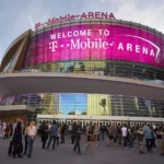 T-Mobile Arena in Las Vegas with curved LED display and crowd gathered outside for event