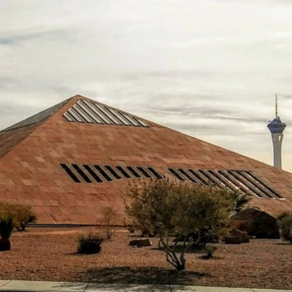 This is a picture of the Clark County Government Building with the Strat in the background on an overcast day in Las Vegas