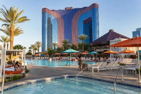 Guests relax around the landscaped Ipanema Pool complex at Rio Hotel & Casino in Las Vegas.