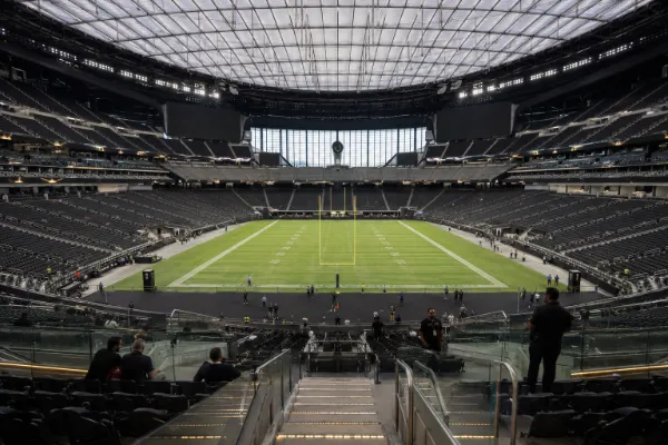 The enclosed Allegiant Stadium seating bowl surrounds the field beneath its fixed translucent roof in Las Vegas.