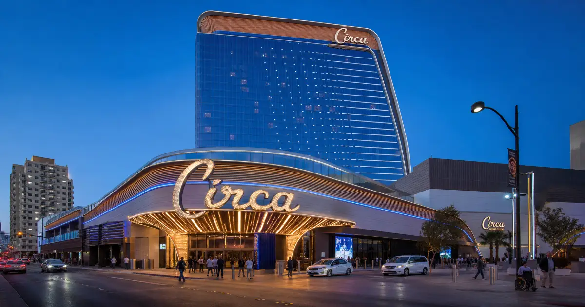 Circa Resort & Casino rises above Fremont Street in Downtown Las Vegas at blue hour.