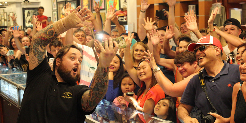 Chumlee from Pawn Stars Gold Silver Pawn Shop taking a selfie with customers and fans of the Pawn Stars show