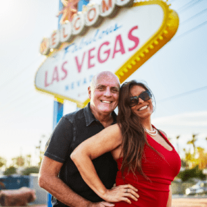 Older couple posing in front of the Welcome to fabulous Las Vegas Sign