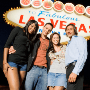 Welcome to fabulous Las Vegas Sign with two couples posing at night