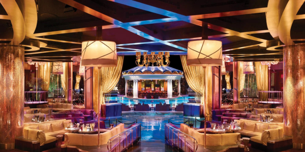 The lavish gold-accented indoor and outdoor pool area at XS Nightclub