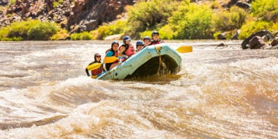 tourists having fun White Water Rafting at the Grand Canyon