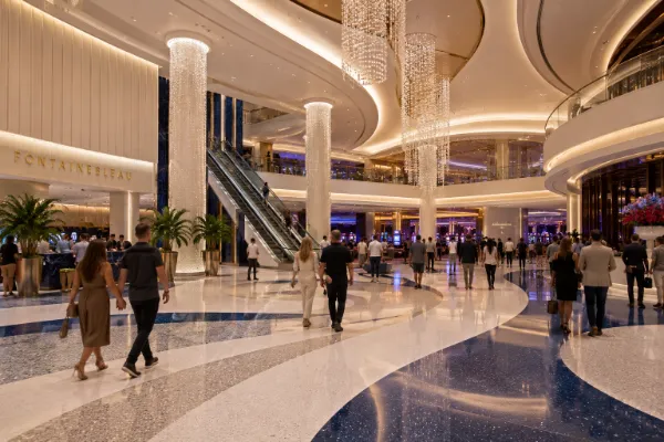 Sweeping architecture, crystal lighting, escalators, and broad walkways define the public interior of Fontainebleau Las Vegas.