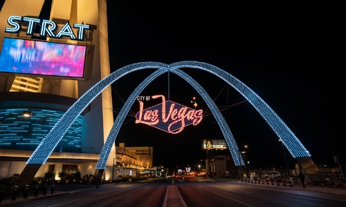 A nighttime view of the Downtown Gateway Arches by the Stratosphere in Las Vegas