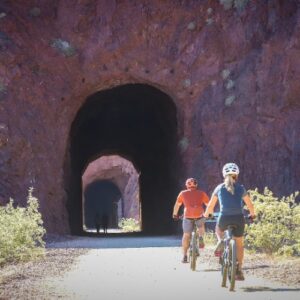 Bicyclists ride on the Lake Mead Railroad Tunnel Trail