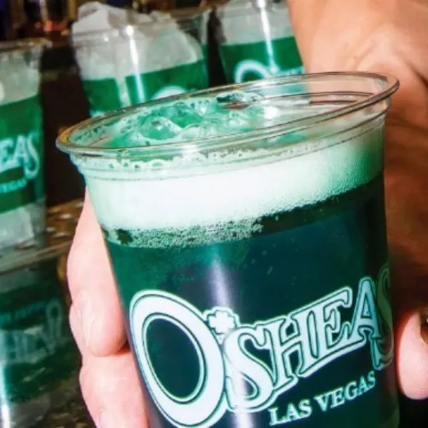 An image of a bartender pouring a green beer for St. Patrick's Day at O'shea's Irish Pub in Las Vegas