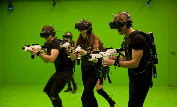 Several people are playing a virtual reality game at Sand Box VR in Las Vegas