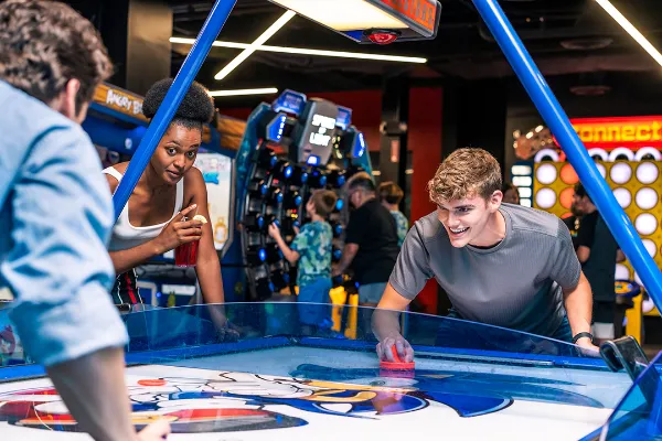 A picture of two guys playing a game at Velocity Esports at the video game arcade at Town Square Las Vegas 