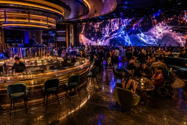 Guests watch sports and enjoy cocktails and DJ music inside Electra Cocktail Club at The Palazzo in Las Vegas.