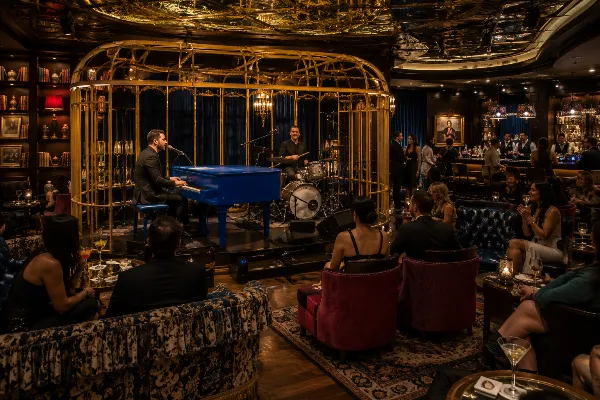 Musicians perform beside the blue baby grand piano inside Juliet Cocktail Room at The Venetian.