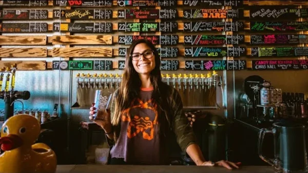 This is an image of a smiling bartender at Able Baker Brewing Company in Las Vegas