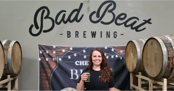 This is an image of the brew master holding a glass of freshly poured beer at Bad Beat Brewing Company Las-Vegas