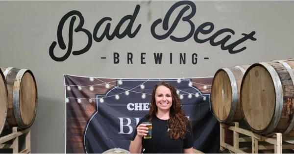 This is an image of the brew master holding a glass of freshly poured beer at Bad Beat Brewing Company Las Vegas