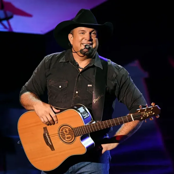 This is a picture of Garth Brooks on stage with his guitar in Concert in Las Vegas