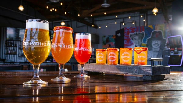 This is a picture of full beer glasses on the bar at Servehzah Bottle Shop and Tap Room