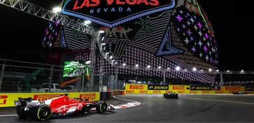 This is a picture of Formula 1 race cars going through the Formula 1 Las Vegas Grand Prix Sphere corner