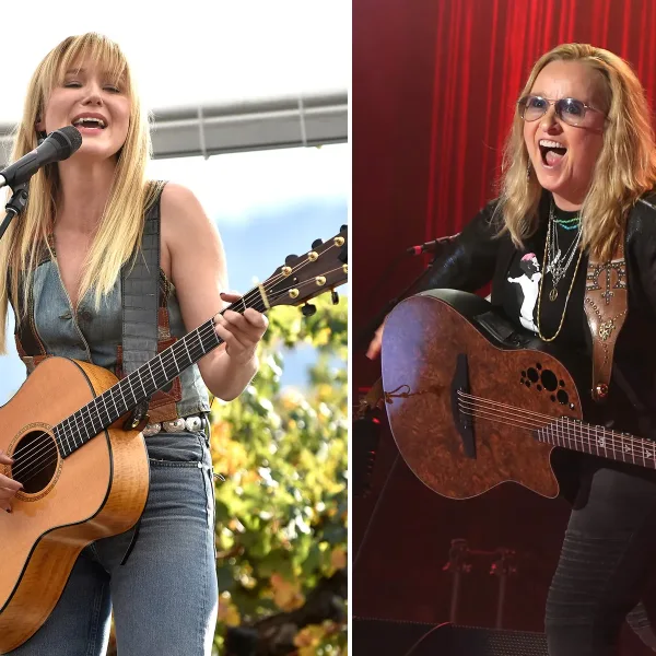 This is a picture of Jewel and Melissa Etheridge singing and playing guitar in concert together