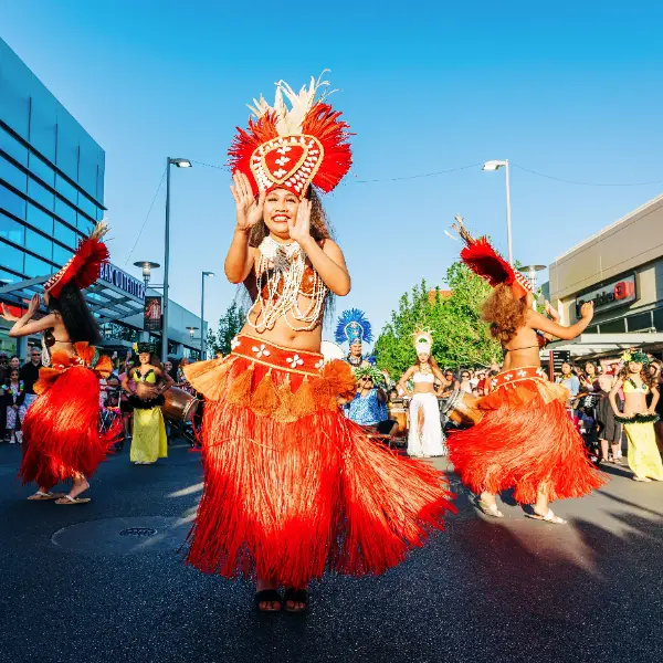 This is a picture of festive dancers performing during the Lei Day Parade and Festival in Downtown Summerlin
