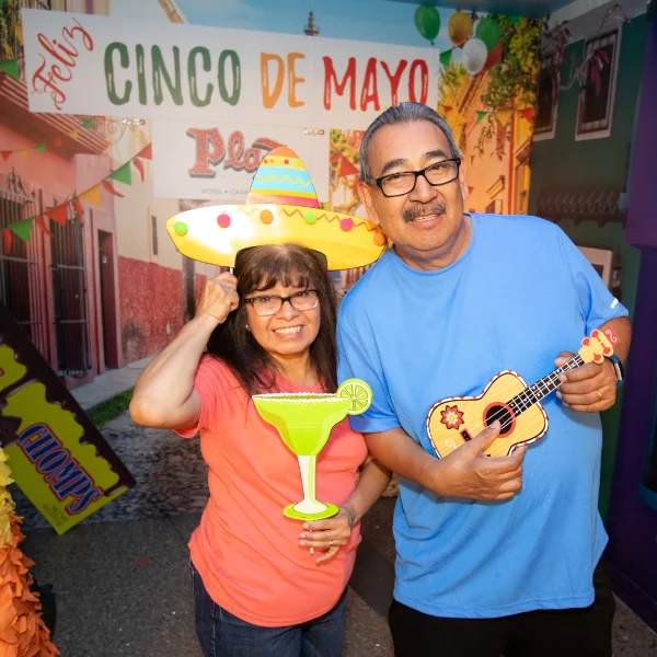 This is a picture of two happy people celebrating at the Plaza Hotel Casino Cinco De Mayo Party