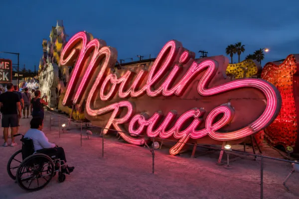 The restored Moulin Rouge neon sign glows inside The Neon Museum’s outdoor collection.