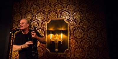 Champagne’s Café dive bar in Las Vegas on karaoke night with red velvet walls