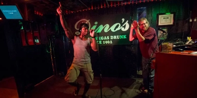 Singer performing karaoke at Dino’s Lounge classic dive bar in Las Vegas