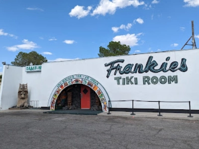 exterior of frankies tiki room dive bar in las vegas with polynesian decor and tiki signage on charleston boulevard