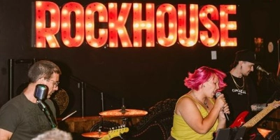 Singer on stage with live band karaoke at Rockhouse bar in Las Vegas