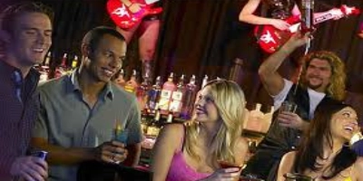 Guests singing karaoke at The Lounge at Excalibur Hotel and Casino in Las Vegas