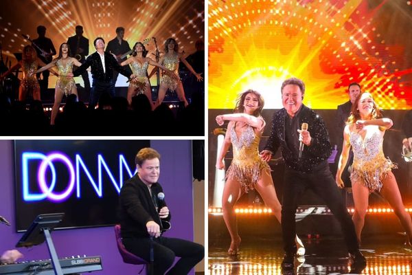A promotional image for the Donny Osmond show in Las Vegas, showing the entertainer with his band and glamorous back-up dancers on stage at Harrah's.