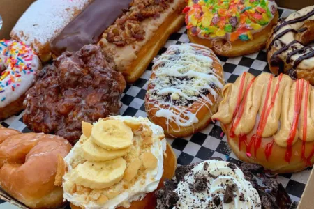 Display case filled with classic donuts at Carl's Donuts Las Vegas