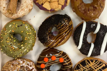 Selection of colorful and creatively decorated donuts at Glaze Doughnuts Las Vegas