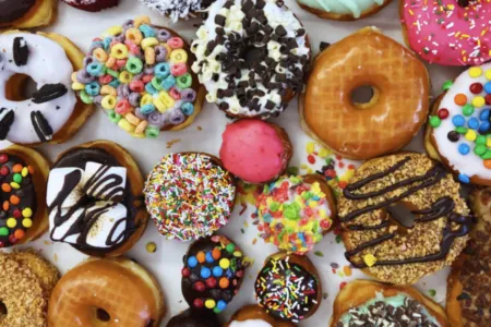 Classic donuts display case at Randy's Donuts Las Vegas with the giant donut sign visible