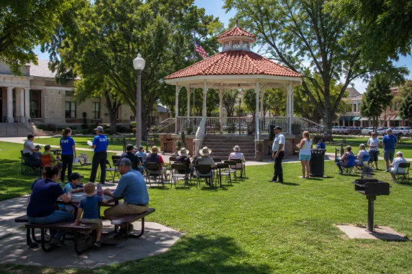 Visitors gather near the gazebo bandstand and shaded lawn at Bicentennial Park in Boulder City.
