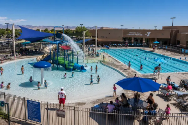 Families and lap swimmers use the seasonal outdoor pool complex at Durango Hills Community Center YMCA in Las Vegas.