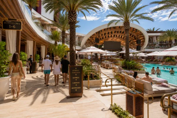 Cabanas, daybeds, tropical landscaping, and open poolside walkways form the hospitality areas at AYU Dayclub.