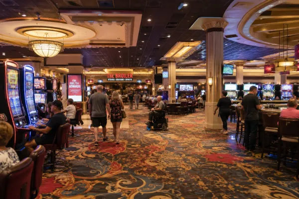 Adult guests move through the refreshed casino floor inside Boulder Station Hotel & Casino in Las Vegas.