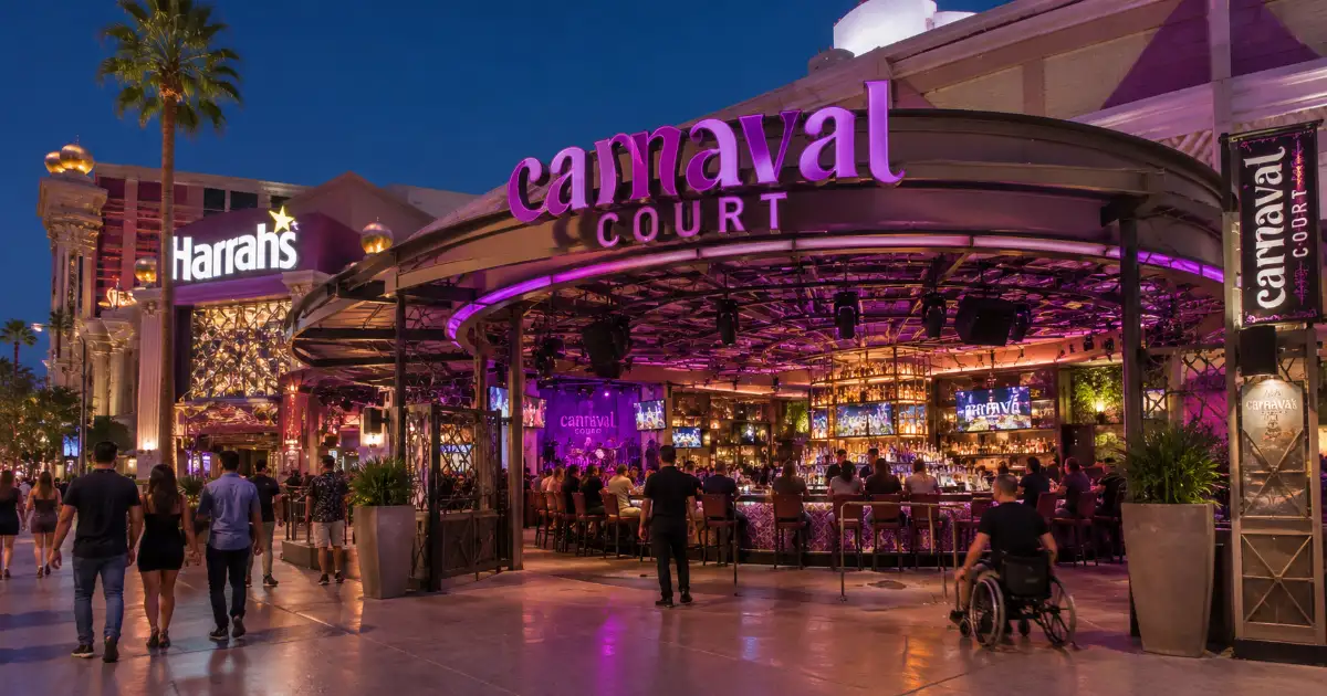 Adult guests gather beneath the open-air canopy at Carnaval Court beside Harrah's Las Vegas.