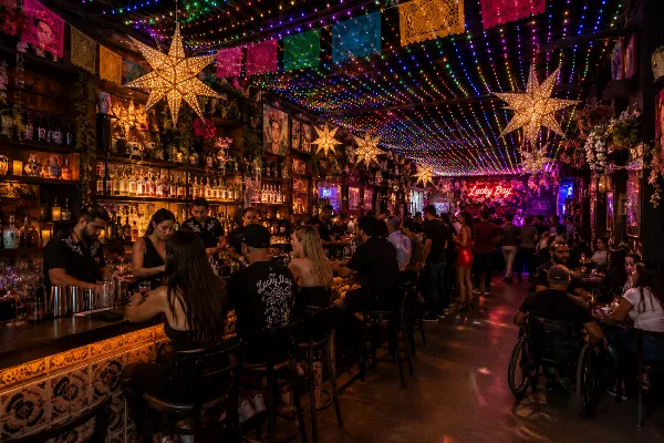 Guests enjoy tequila cocktails beneath the illuminated ceiling inside Lucky Day in Downtown Las Vegas.