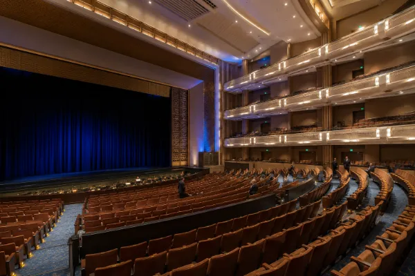 The stage, orchestra seating, and curved balcony levels inside Reynolds Hall at The Smith Center.