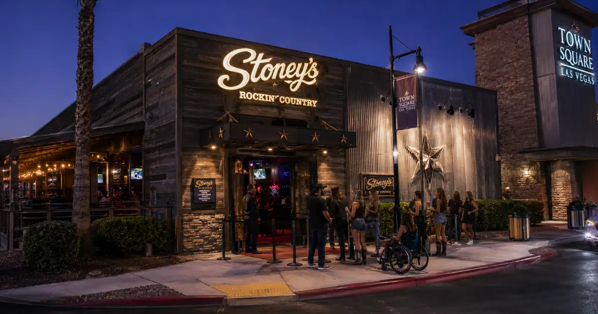 Country-music fans arrive at the illuminated entrance to Stoney’s Rockin’ Country at Town Square Las Vegas.
