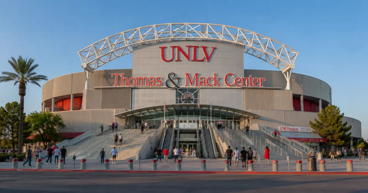 Thomas & Mack Center entrance with its roof arch, UNLV lettering, stairways, and plaza on the UNLV campus in Las Vegas.