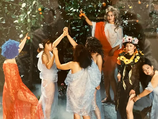 A promotional image for the Bellagio Gallery of Fine Art, showing a person walking through a gallery with a vibrant art piece.