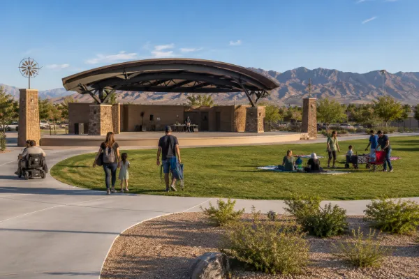 The covered outdoor stage and grass lawn at Centennial Hills Park Amphitheatre provide space for community events in northwest Las Vegas.